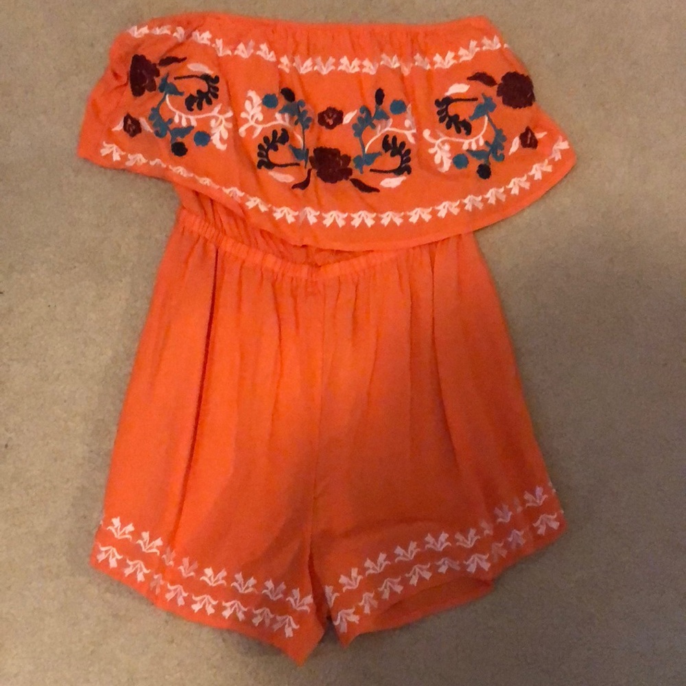 An orange off the shoulder romper from Rue 21